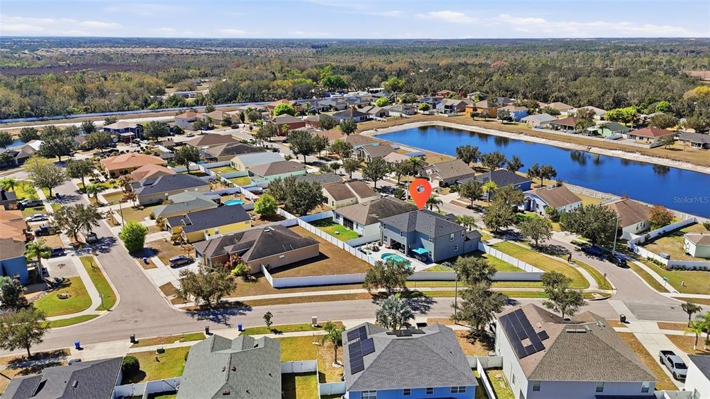 14604 Rannoch Moor Place Wimauma, FL 33598 - Photo 72 of 76 an aerial view of a houses with a lake view