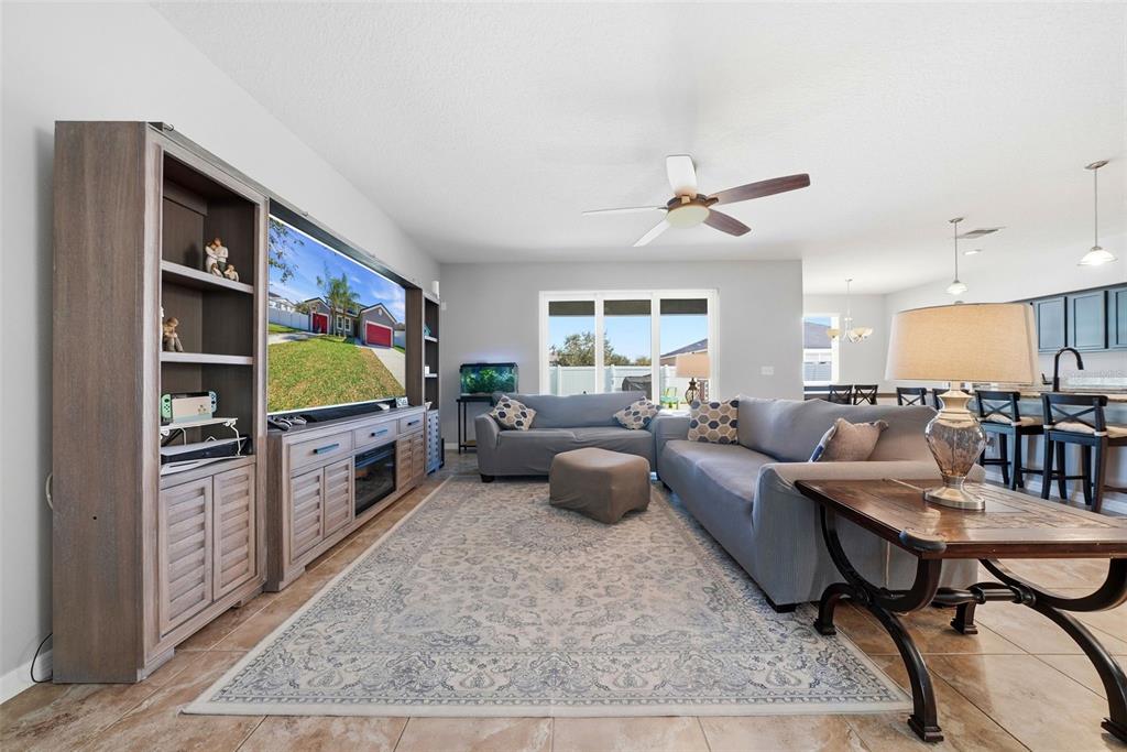 14604 Rannoch Moor Place Wimauma, FL 33598 - Photo 8 of 76 a living room with furniture and a flat screen tv