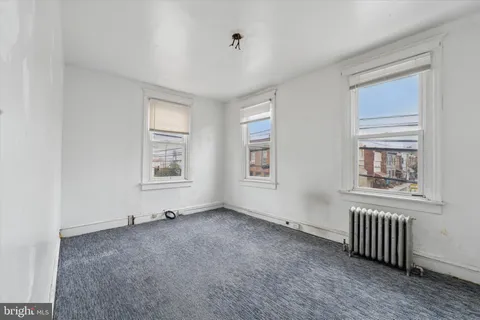 a view of empty room with windows