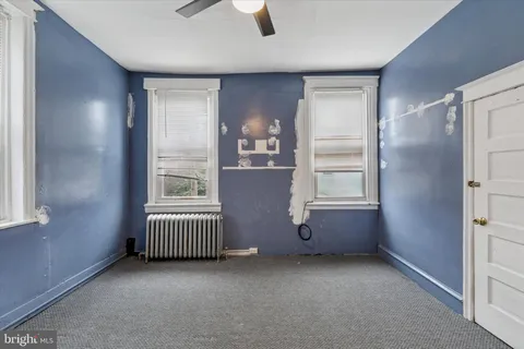 a view of a chairs and table in backyard