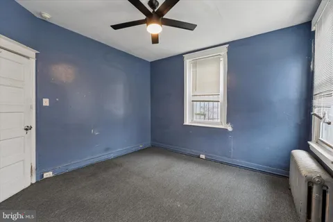 a brick building with a bench in front of it