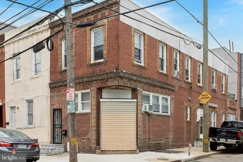 a balcony with furniture and a potted plant