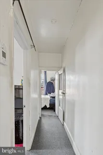 a brick building with a bench in front