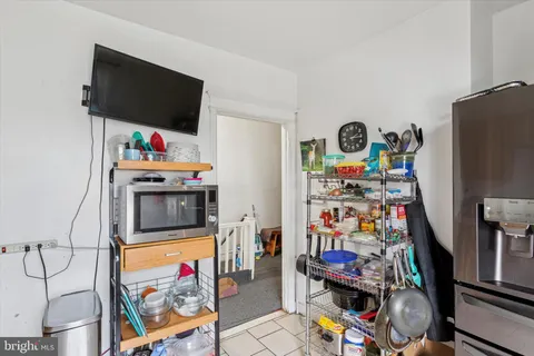 a bedroom with a bed and a desk