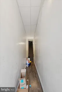 a bedroom with furniture and a flat screen tv