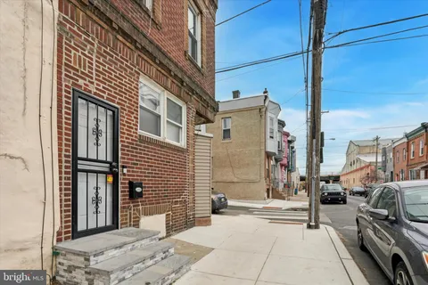 a living room with furniture and a gym equipment