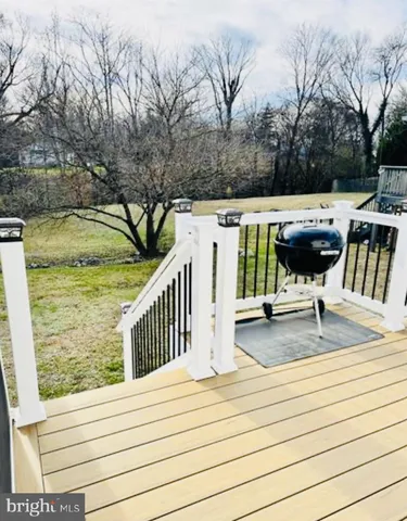 a view of a bench in the backyard