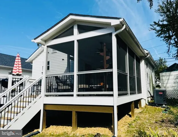 a kitchen with a stove a sink and a microwave