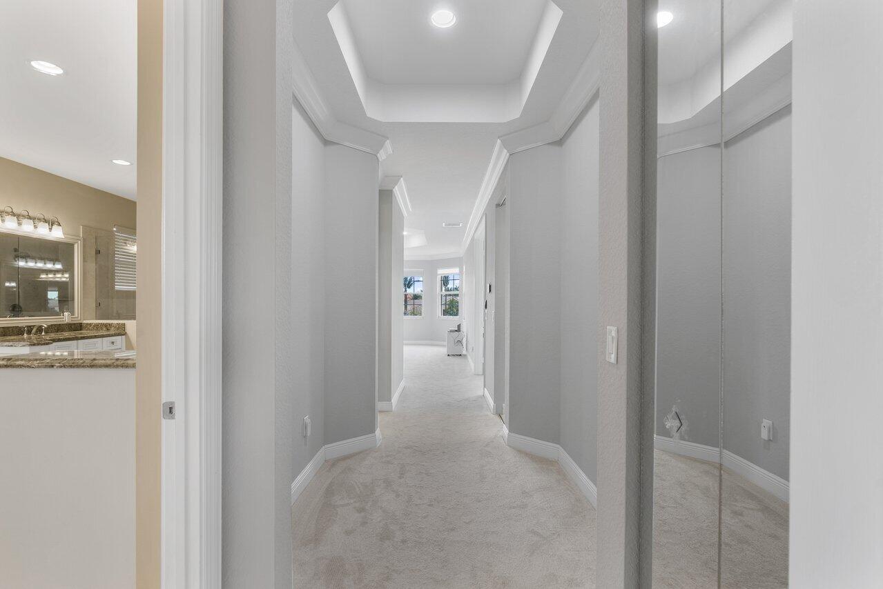 8626 Daystar Ridge Point Boynton Beach, FL 33473 - Photo 21 of 58 hallway into Primary Suite Upstairs
