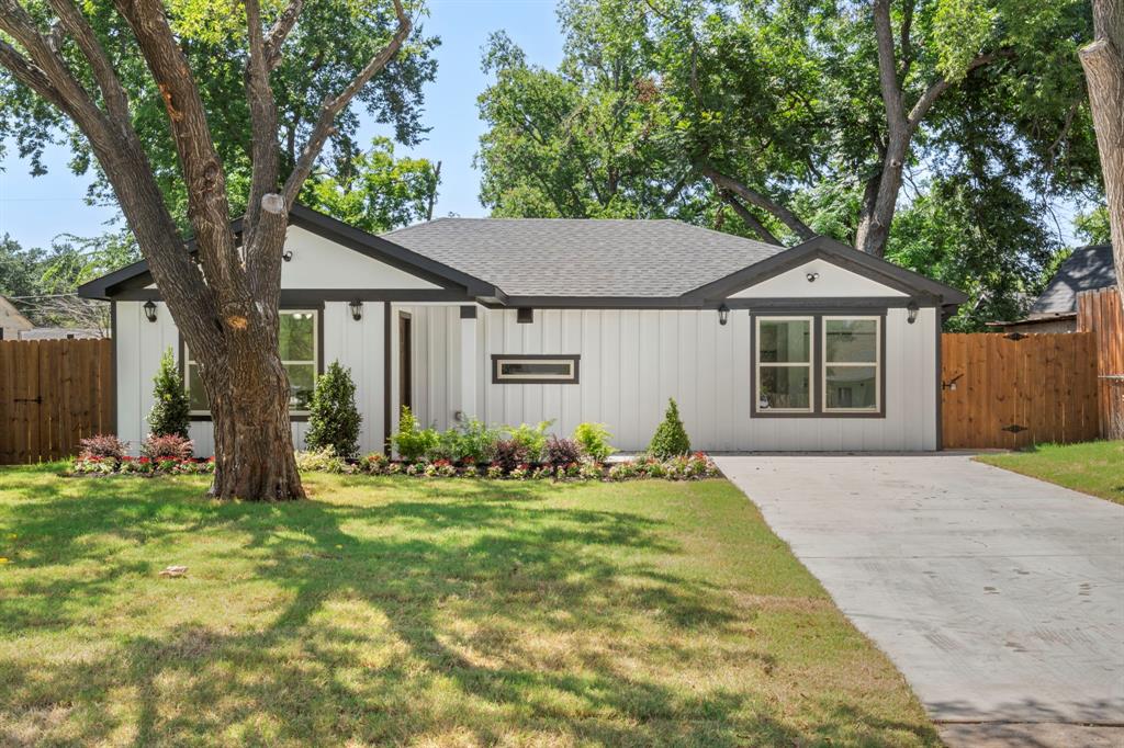 825 Apache Trace Grand Prairie, TX 75051 - Photo 4 of 30 a front view of a house with a yard