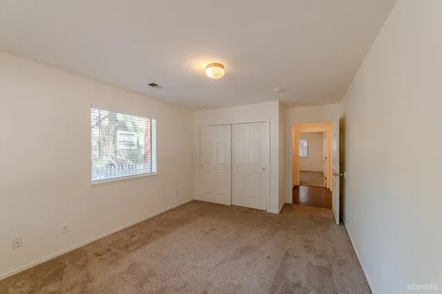 a big room with windows and closet
