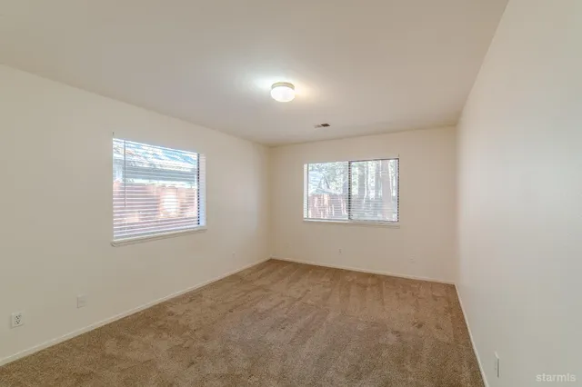 a room with a table and chairs