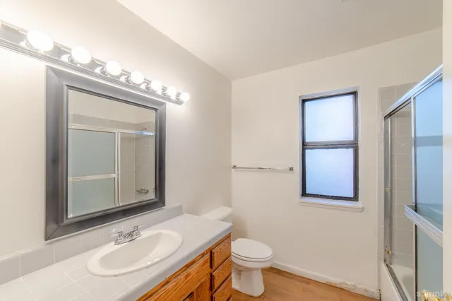 a view of a park with large trees