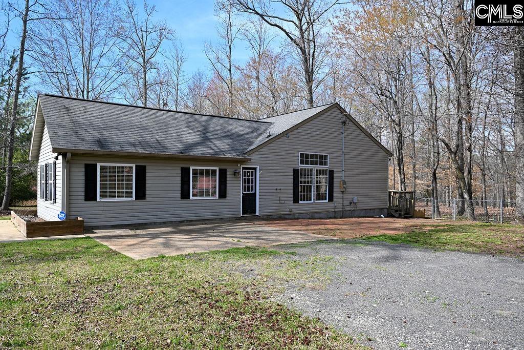88 Running Deer Road Blythewood, SC 29016 - Photo 3 of 24 a view of a yard in front of a house