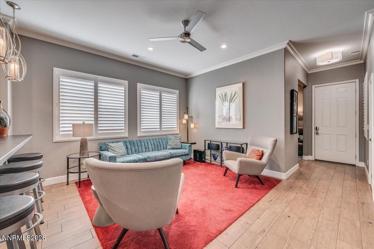10562 Thistle Berry Court Reno, NV 89521 - Photo 19 of 44 a living room with furniture and a large window