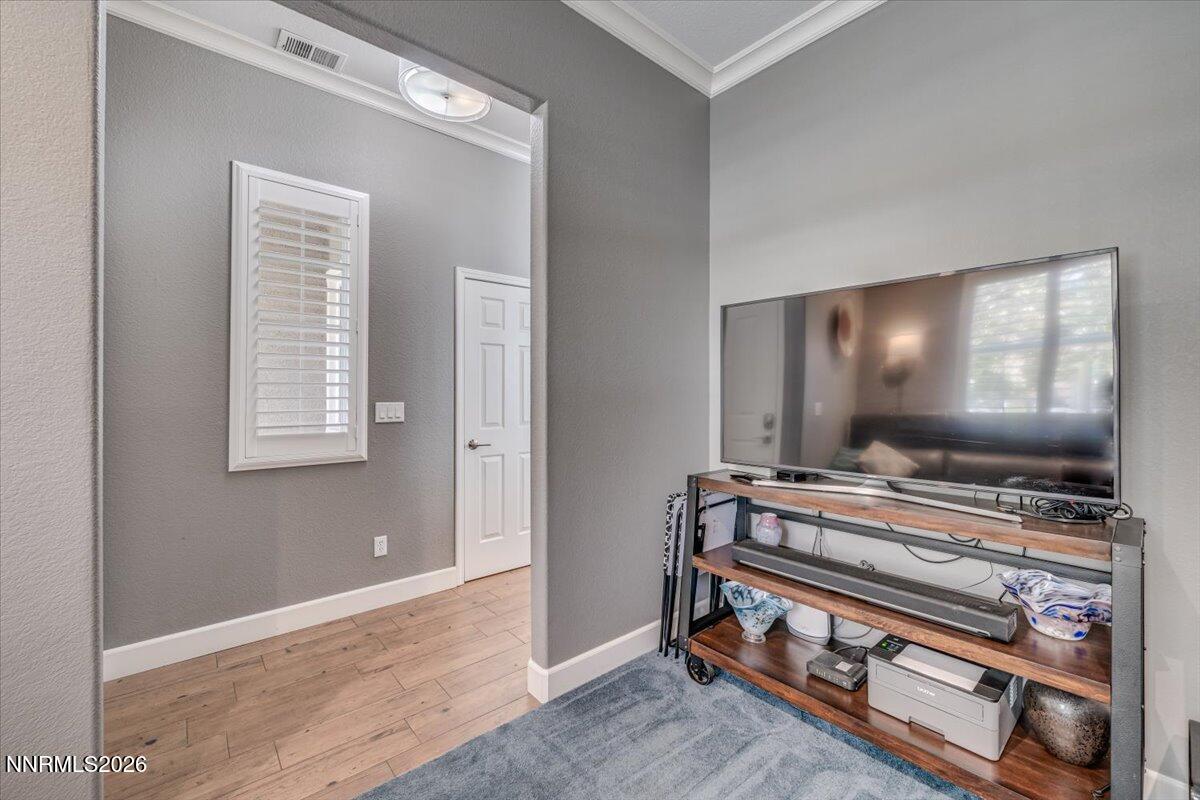 10562 Thistle Berry Court Reno, NV 89521 - Photo 23 of 44 a room with furniture and a flat screen tv