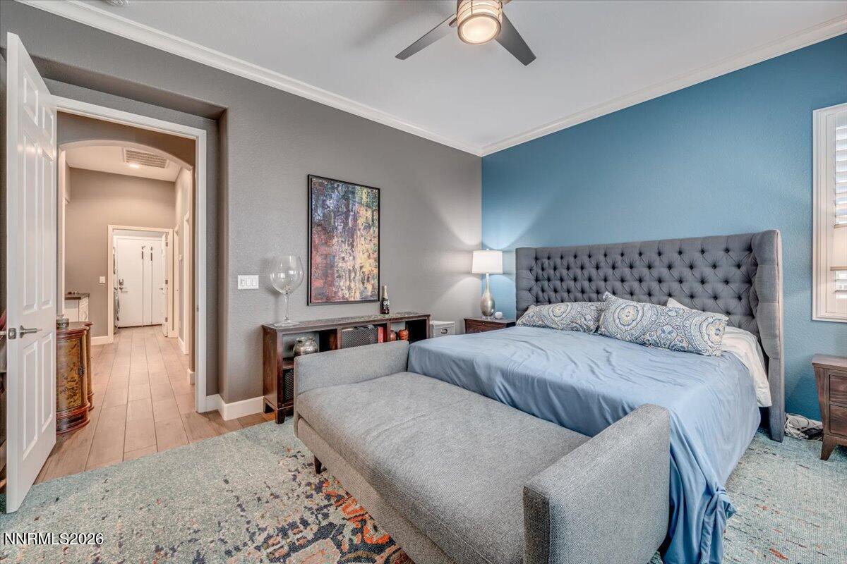 10562 Thistle Berry Court Reno, NV 89521 - Photo 24 of 44 a bedroom with a bed and a mirror
