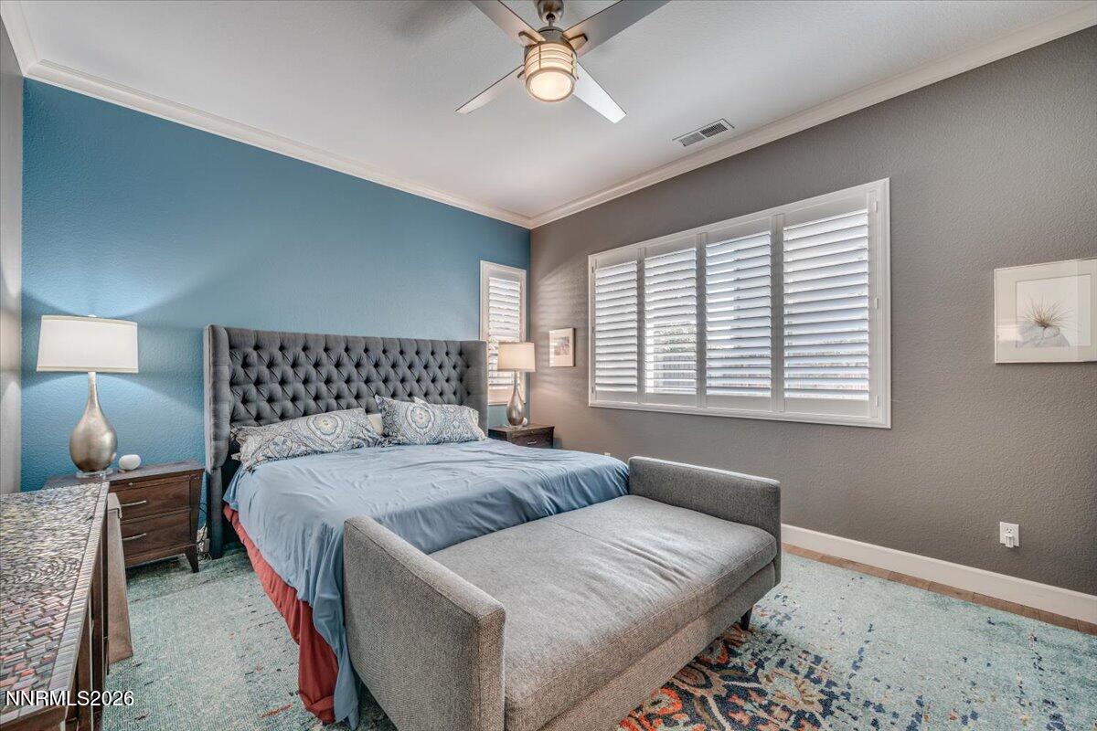 10562 Thistle Berry Court Reno, NV 89521 - Photo 26 of 44 a bedroom with a bed and window