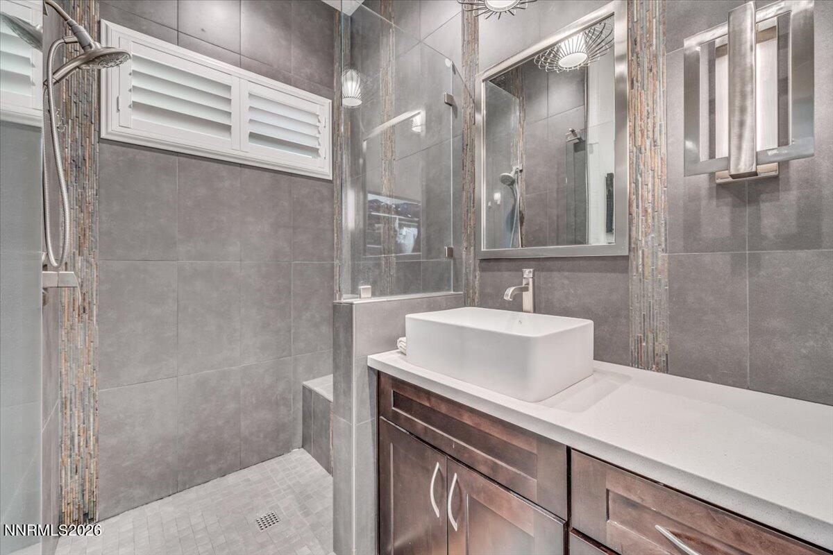 10562 Thistle Berry Court Reno, NV 89521 - Photo 29 of 44 a bathroom with a sink and a mirror