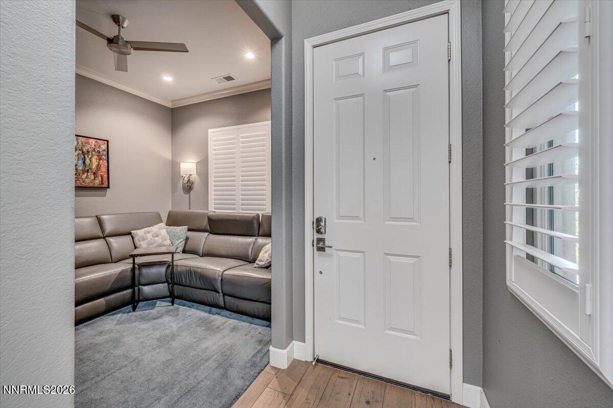 10562 Thistle Berry Court Reno, NV 89521 - Photo 33 of 44 a living room with furniture and a window