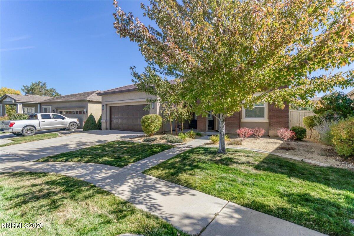 10562 Thistle Berry Court Reno, NV 89521 - Photo 44 of 44 a house view with a garden space