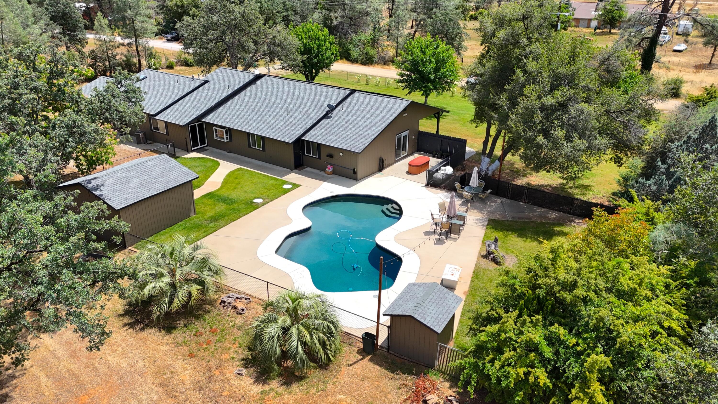 17536 Oly Way Anderson, CA 96007 - Photo 37 of 51 an aerial view of a house with a yard and trees