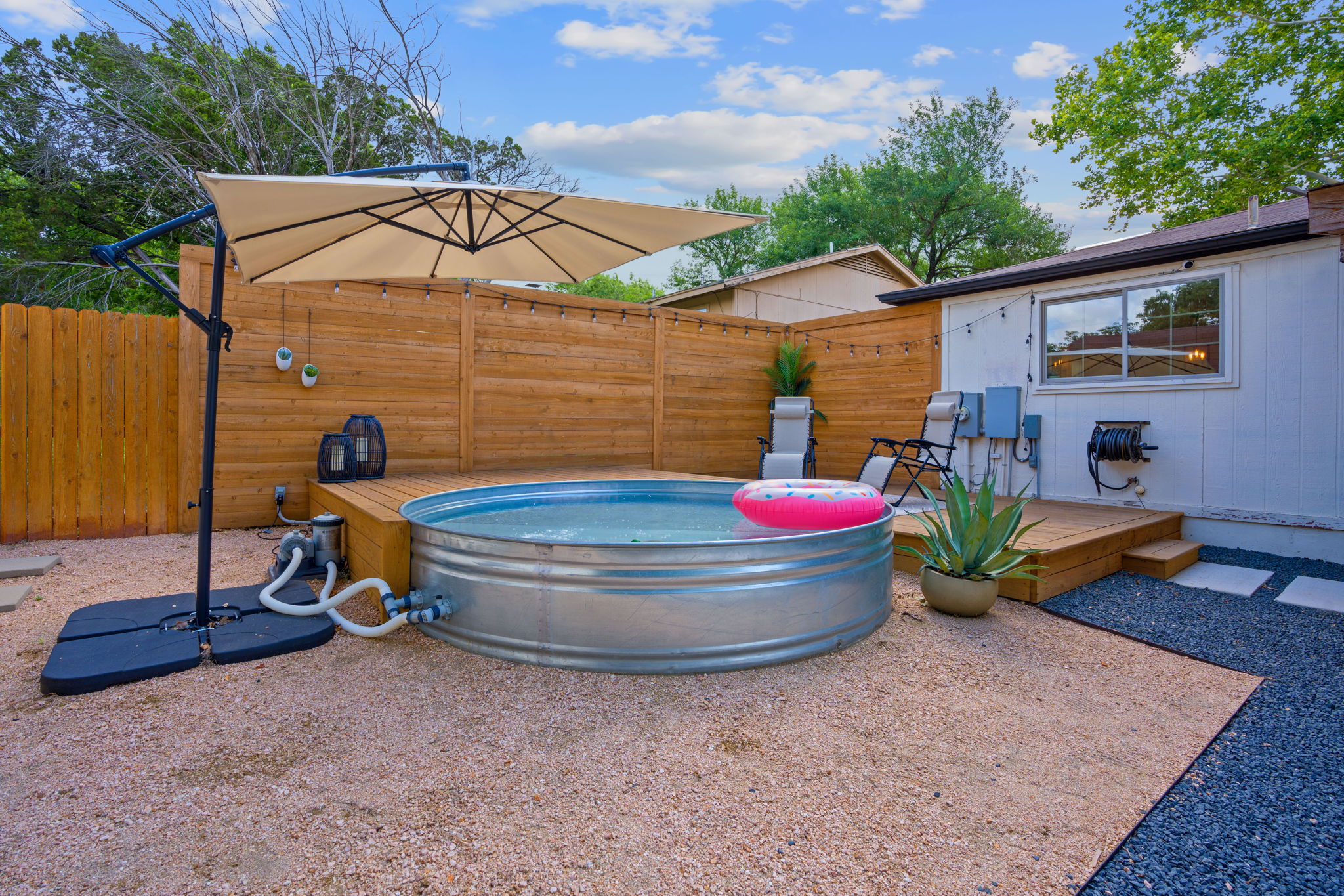 7110 Tawny Circle Austin, TX 78745 - Photo 26 of 30 Fenced backyard with a deck and cowboy pool
