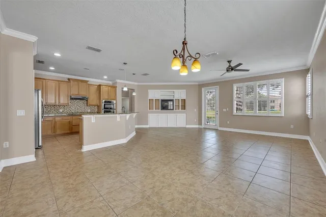 a view of a kitchen with a sink and a refrigerator wooden floor