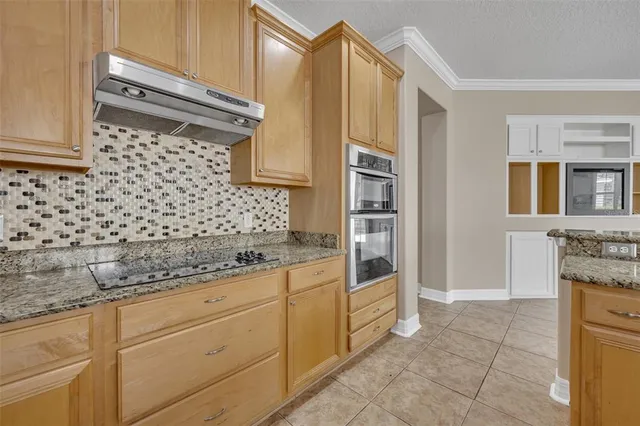 a bathroom with a granite countertop sink a vanity and a