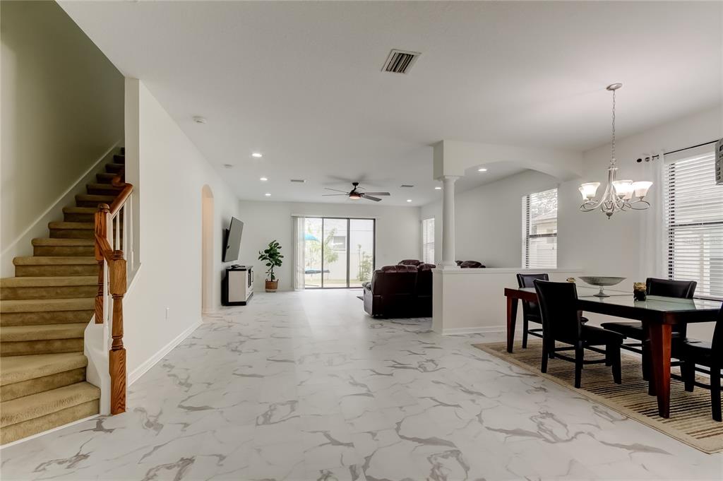 12747 Tikal Way Trinity, FL 34655 - Photo 12 of 40 a large kitchen with a table and chairs