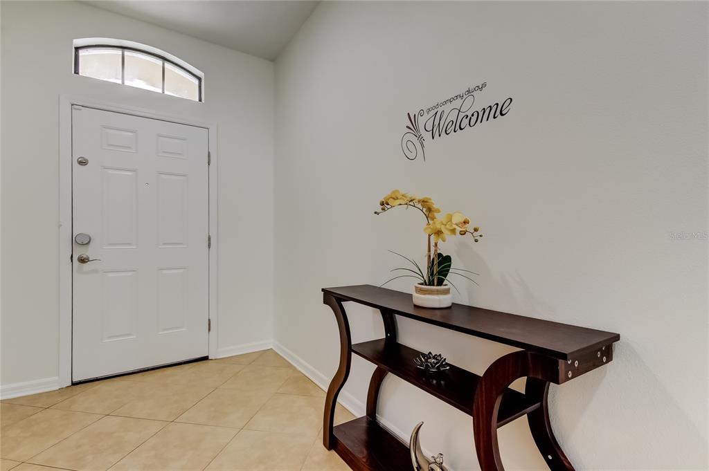 12747 Tikal Way Trinity, FL 34655 - Photo 2 of 40 a view of a hallway that has a wine table in it