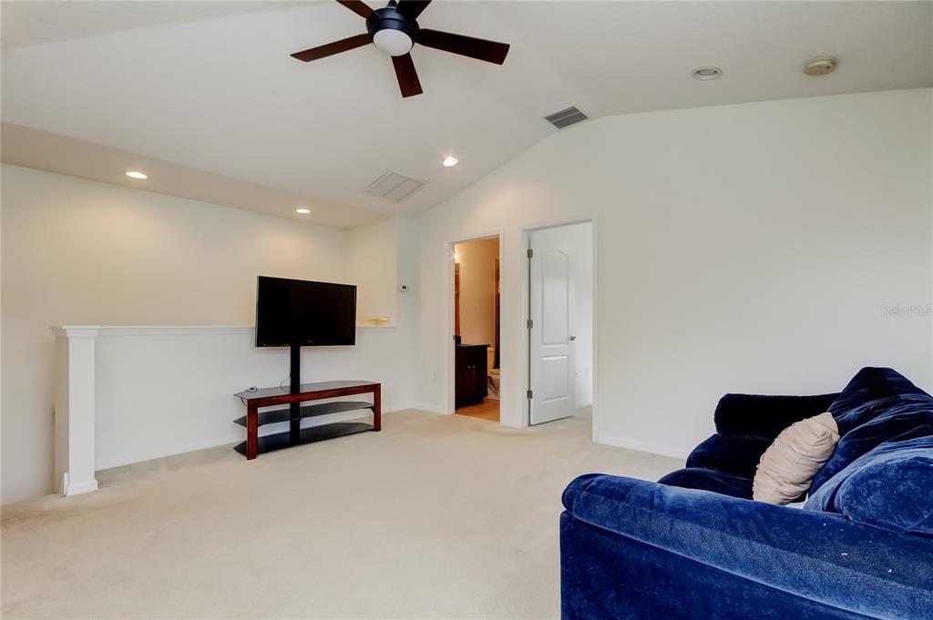 12747 Tikal Way Trinity, FL 34655 - Photo 23 of 40 a living room with furniture and a flat screen tv