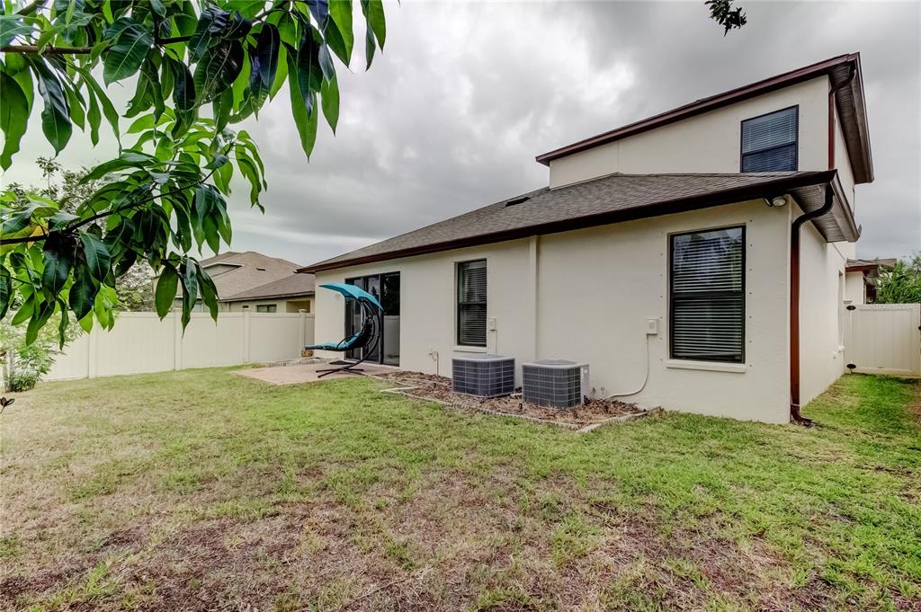 12747 Tikal Way Trinity, FL 34655 - Photo 35 of 40 a view of a house with backyard and sitting area