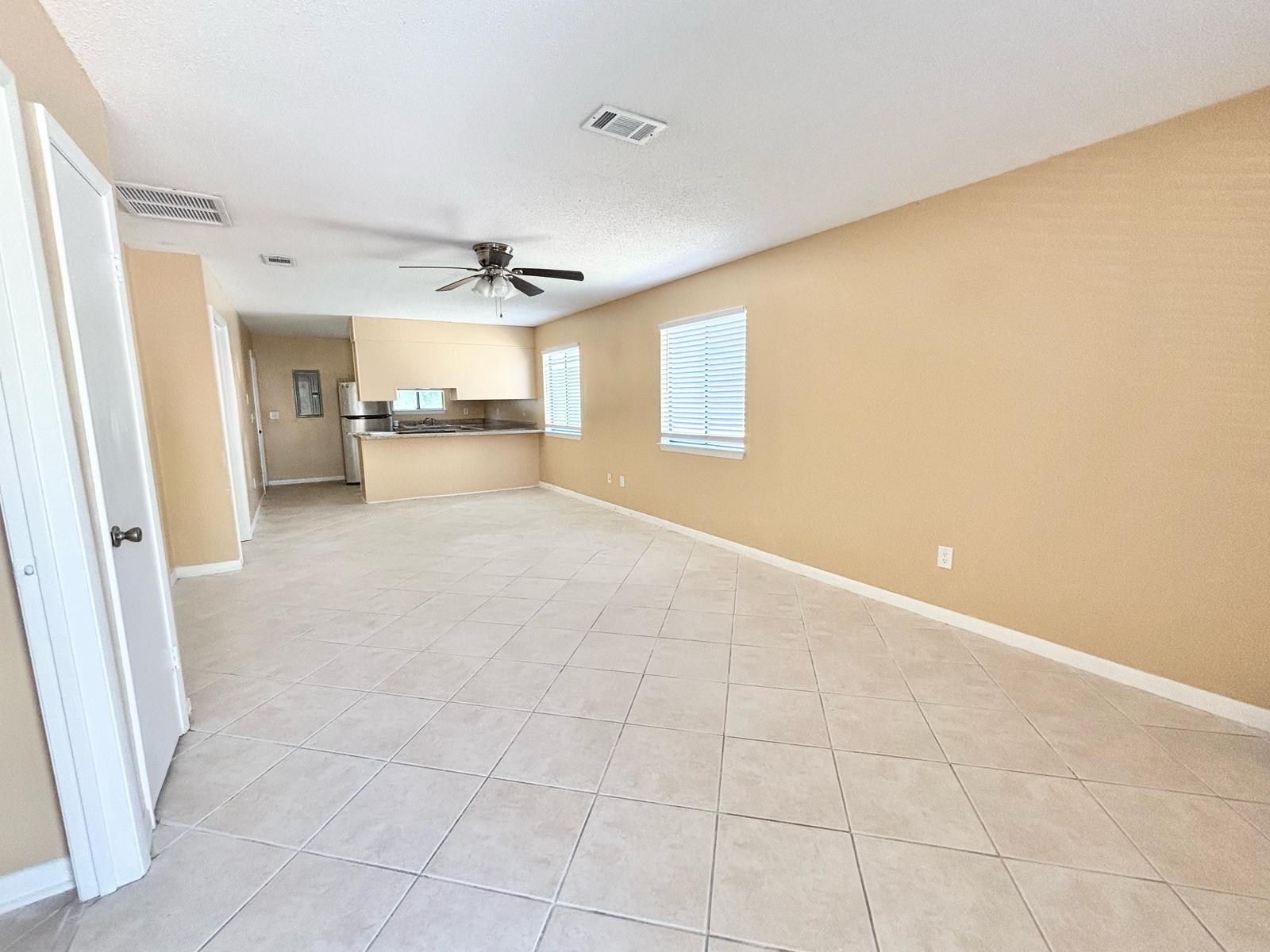25 Blenheim Lane, Unit 4 Santa Rosa Beach, FL 32459 - Photo 4 of 13 a view of a livingroom with a ceiling fan and window