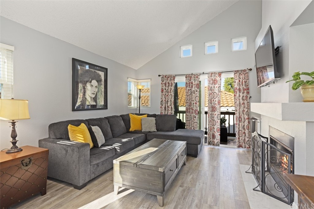 19 Brisa Ribera Rancho Santa Margarita, CA 92688 - Photo 4 of 16 a view of a dining room with furniture and wooden floor