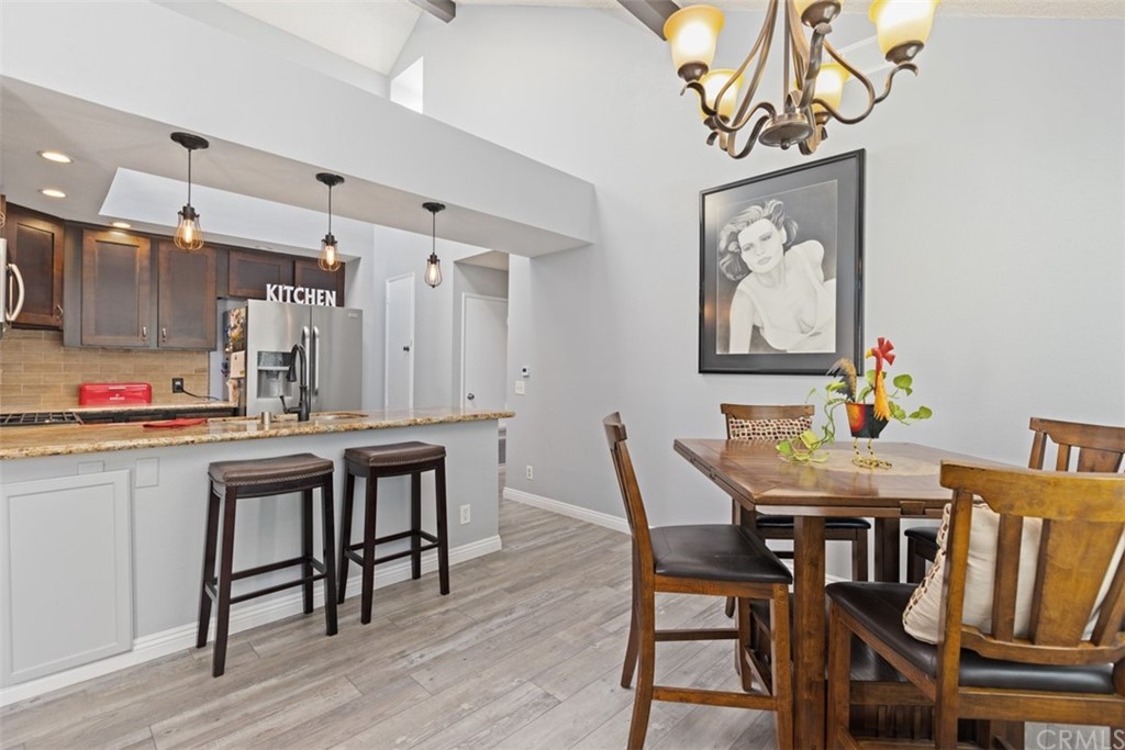 19 Brisa Ribera Rancho Santa Margarita, CA 92688 - Photo 5 of 16 a kitchen with kitchen island granite countertop a sink and refrigerator