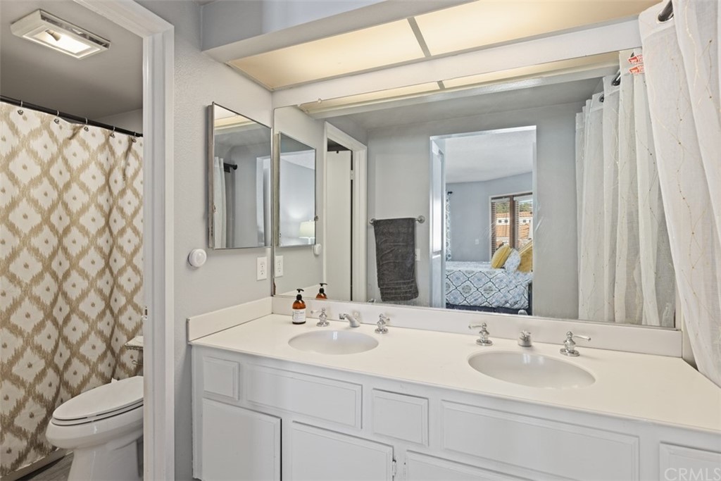 19 Brisa Ribera Rancho Santa Margarita, CA 92688 - Photo 9 of 16 a bedroom with a bed and wooden floor