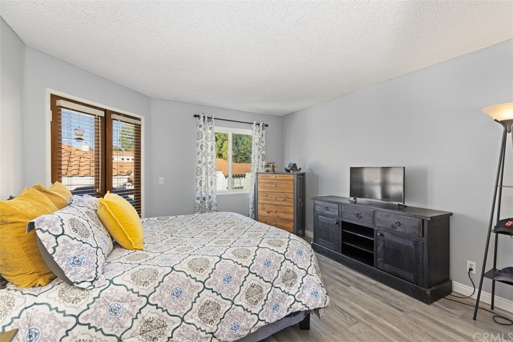 19 Brisa Ribera Rancho Santa Margarita, CA 92688 - Photo 10 of 16 a bedroom with a bed and wooden floor