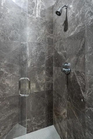 a living room with furniture and a painting on the wall