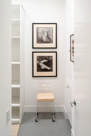 a room with walk in closet and wooden floor