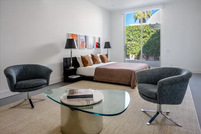 a living room with furniture and a lamp