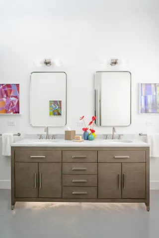 a bathroom with a glass shower door