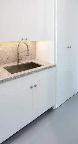 a view of a house with a flower garden