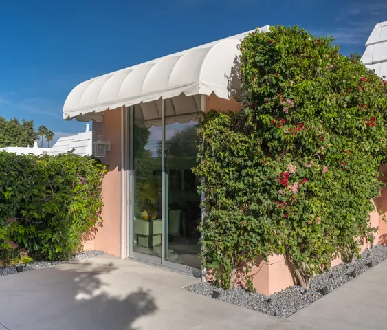 a big yard with trees in the background