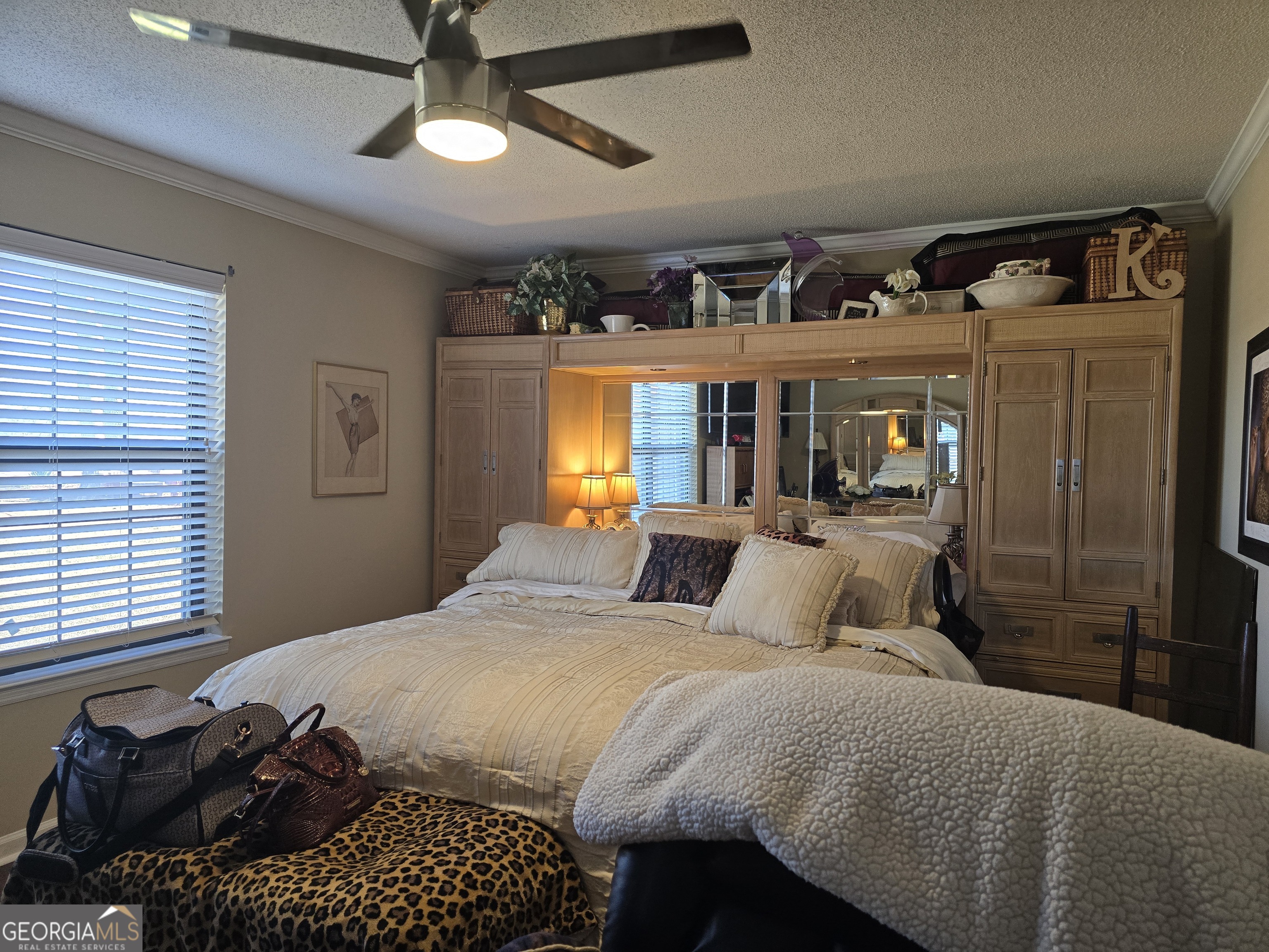 479 Mitchell Loop Bluffton, GA 39824 - Photo 23 of 51 a bedroom with a bed next to a window and a chandelier