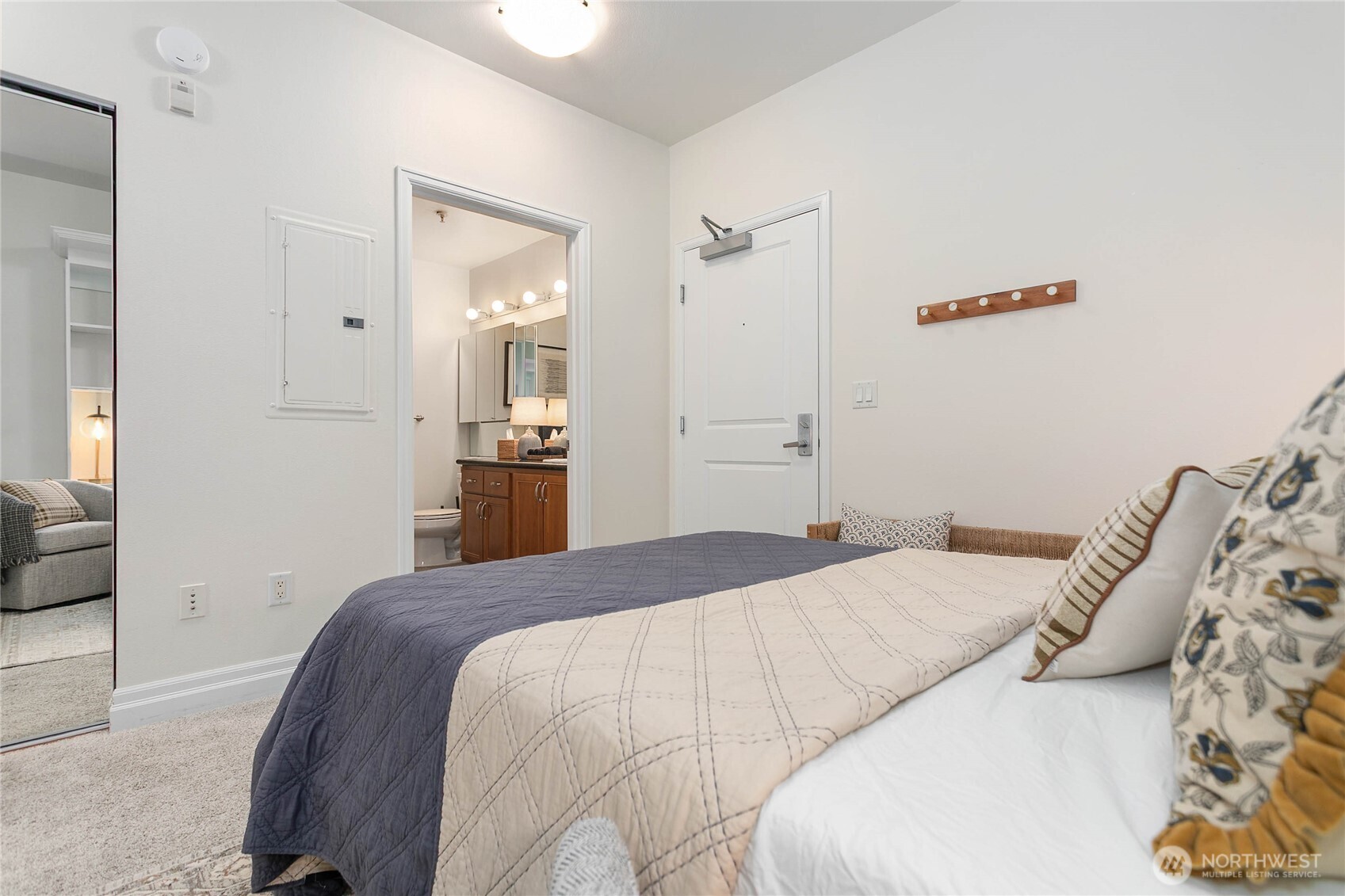 1310 10th Street, Unit 408 Bellingham, WA 98225 - Photo 20 of 33 a bedroom with a bed and a mirror