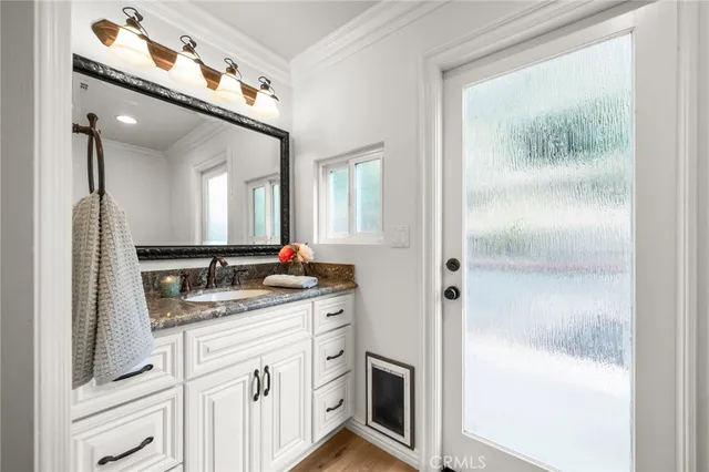 a bedroom with a large bed and a flat screen tv