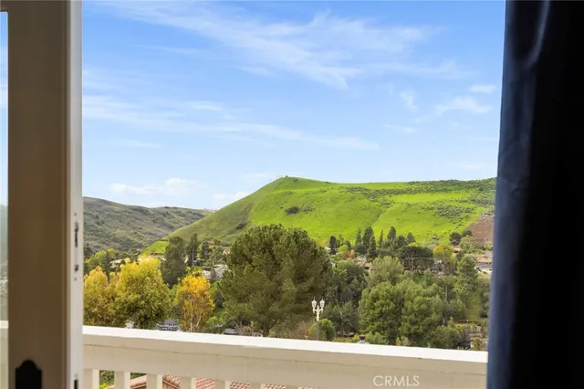 a bathroom with a granite countertop bathtub shower sink and mirror