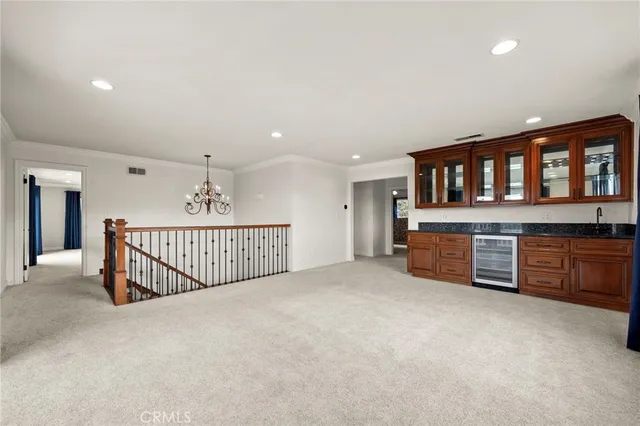 a view of a livingroom with a ceiling fan and window