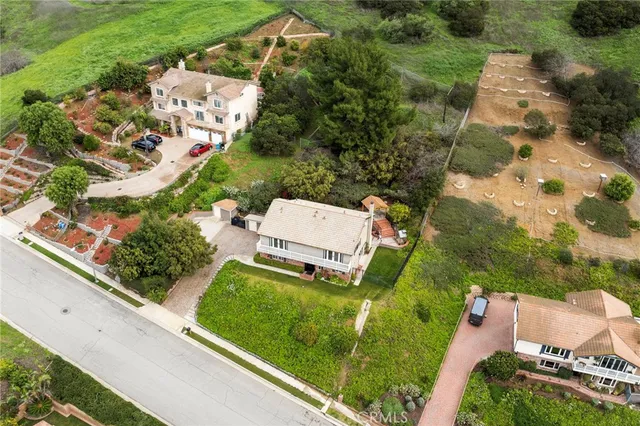 a view of a porch with furniture and a yard